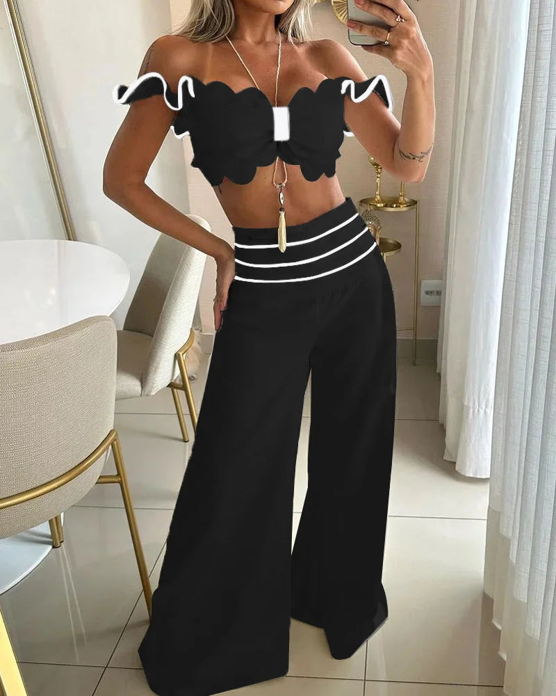 SÆT BESTÅENDE AF TO DELE I EN ENFARVET FARVE MED OFF-SHOULDER